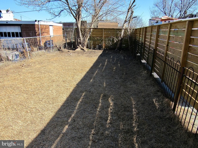 view of yard with a fenced backyard