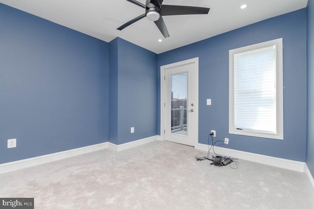 carpeted spare room with a ceiling fan, recessed lighting, and baseboards