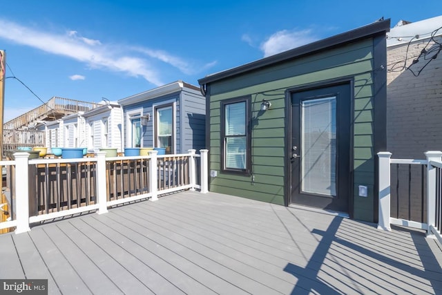 wooden deck with a residential view