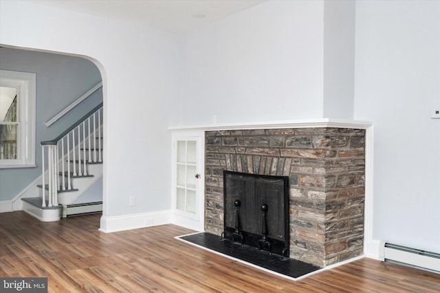 117 Morningside Dr, Trenton, NJ 08618 - interior details with a baseboard radiator, arched walkways, baseboards, and wood finished floors