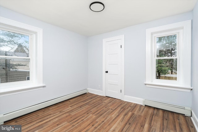 117 Morningside Dr, Trenton, NJ 08618 - spare room with a baseboard radiator, baseboards, and dark wood-style flooring