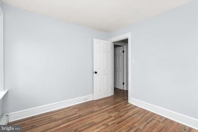 117 Morningside Dr, Trenton, NJ 08618 - unfurnished room featuring a baseboard heating unit, baseboards, and dark wood finished floors