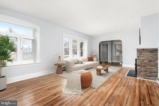 117 Morningside Dr, Trenton, NJ 08618 - living area with arched walkways, wood finished floors, and baseboards