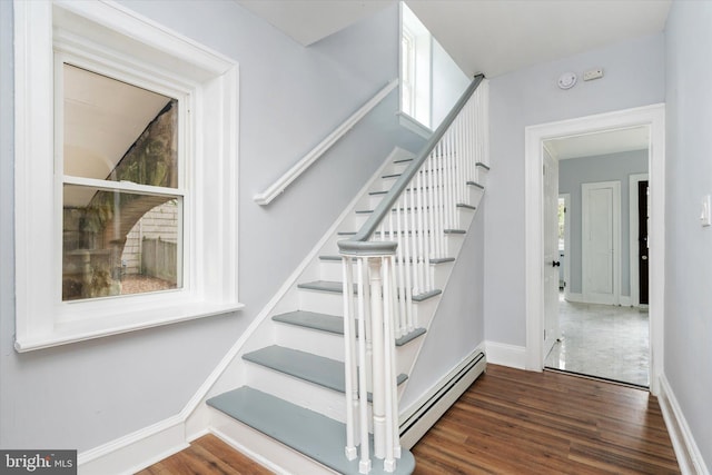 117 Morningside Dr, Trenton, NJ 08618 - stairway featuring baseboard heating, wood finished floors, and baseboards