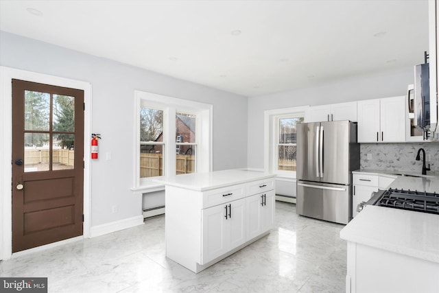 117 Morningside Dr, Trenton, NJ 08618 - kitchen with a baseboard radiator, stainless steel appliances, marble finish floor, light countertops, and a center island