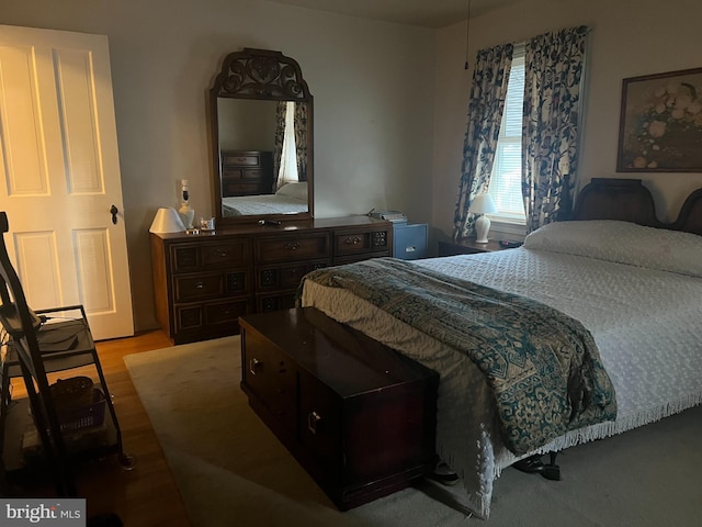 bedroom with wood finished floors