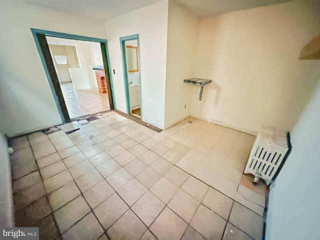 empty room featuring light tile patterned floors