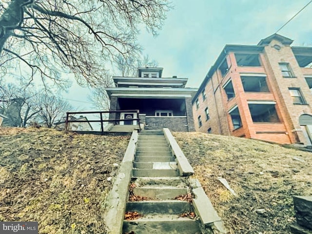 view of front of house with stairway