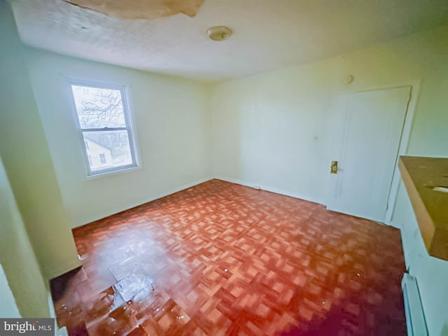 empty room featuring baseboard heating