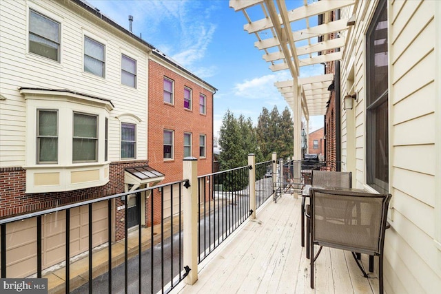 balcony featuring a pergola