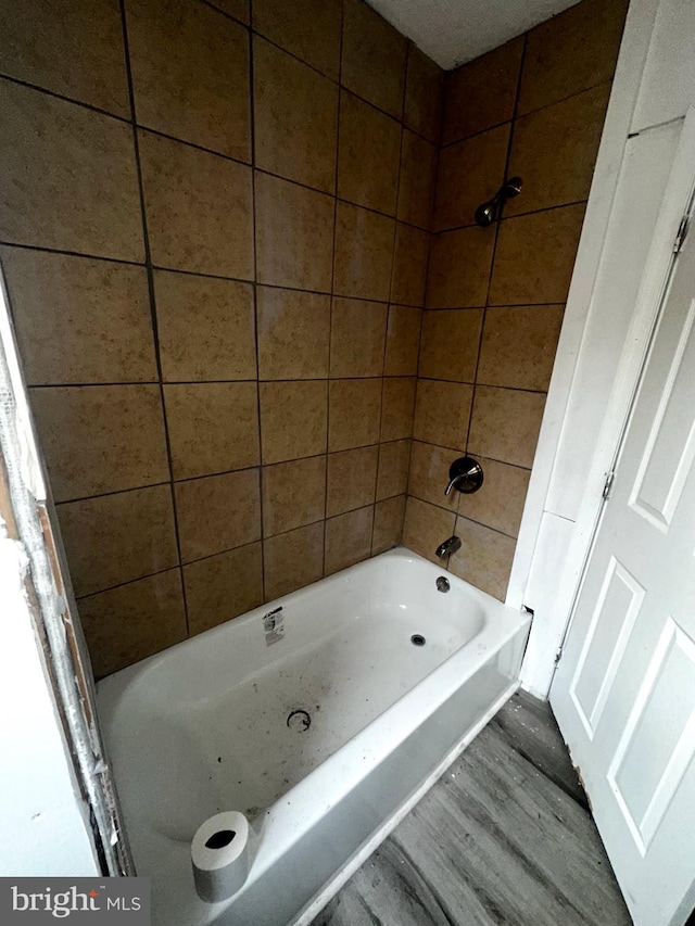 full bath with  shower combination and wood finished floors