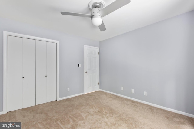 15431 Machodoc Dr, King George, VA 22485 - unfurnished bedroom with carpet flooring, baseboards, a closet, and a ceiling fan