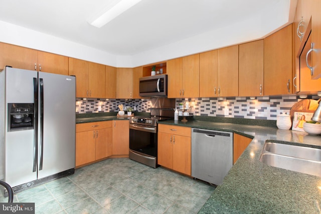 15431 Machodoc Dr, King George, VA 22485 - kitchen with stainless steel appliances, decorative backsplash, and dark countertops