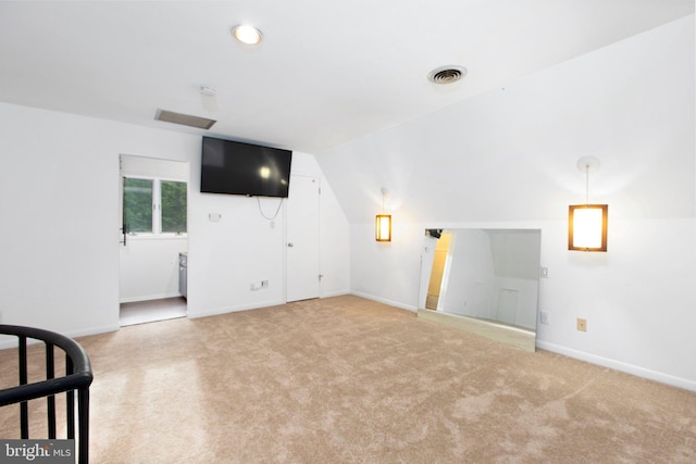 15431 Machodoc Dr, King George, VA 22485 - unfurnished living room featuring light colored carpet, vaulted ceiling, and baseboards