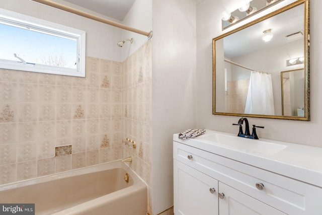 full bathroom featuring vanity, visible vents, and shower / tub combo with curtain