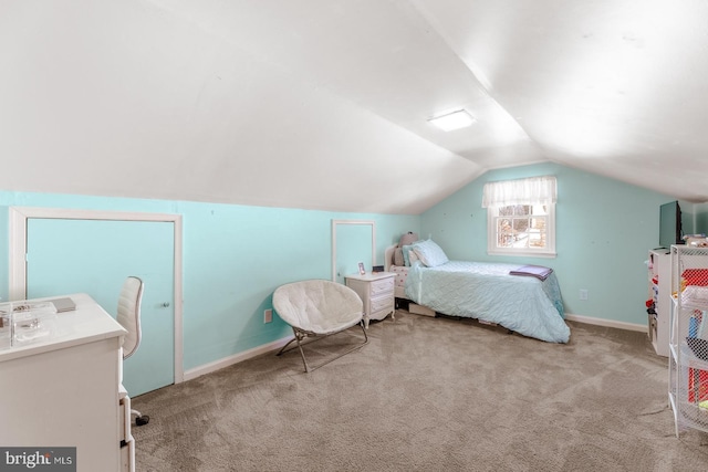 bedroom featuring carpet, vaulted ceiling, and baseboards