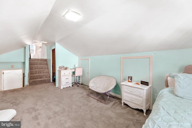 carpeted bedroom featuring vaulted ceiling