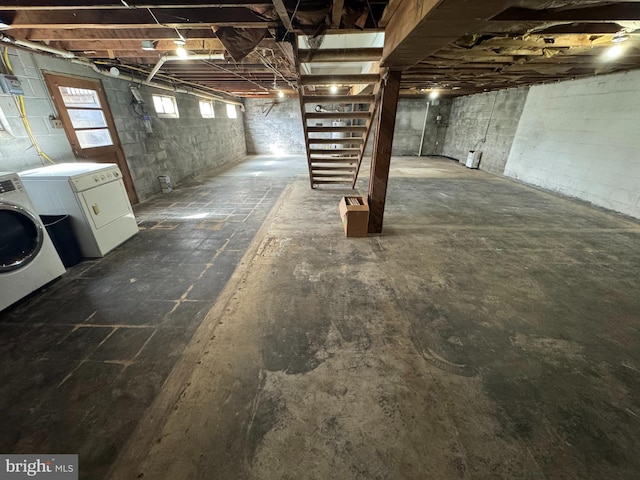 basement with stairway and washing machine and dryer