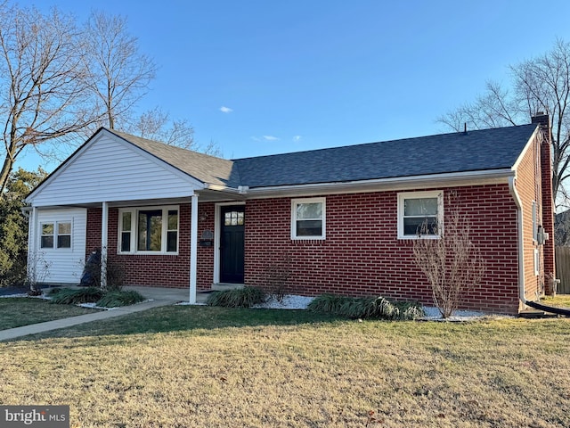 single story home featuring roof with shingles, a chimney, a front lawn, and brick siding