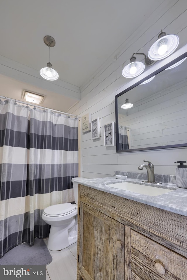 full bath featuring toilet, wood walls, vanity, ornamental molding, and a shower with curtain