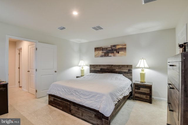 bedroom with visible vents and baseboards