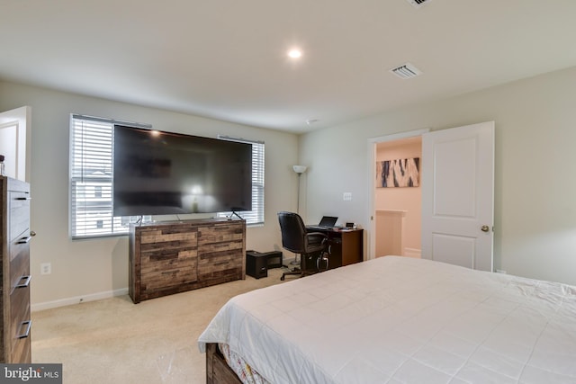 carpeted bedroom featuring visible vents and baseboards