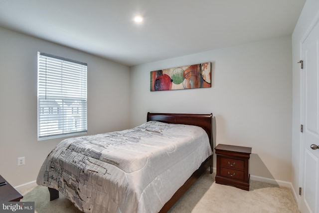 carpeted bedroom with baseboards