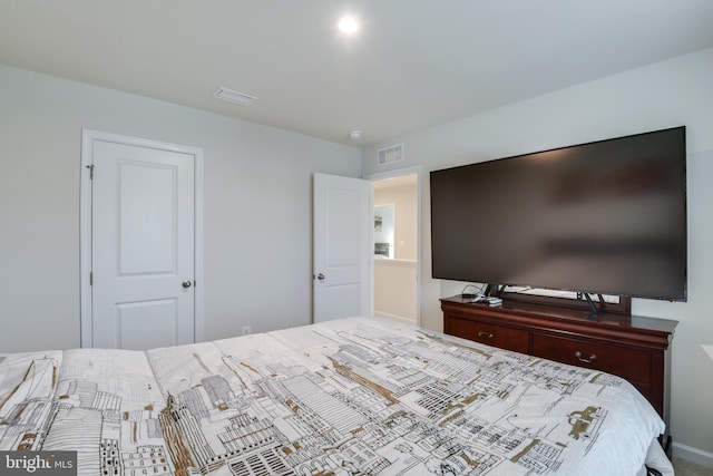 bedroom featuring visible vents