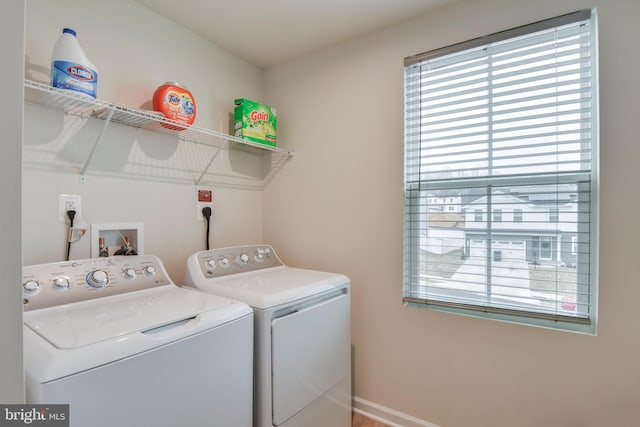 washroom featuring laundry area and washing machine and dryer