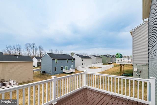 wooden deck featuring a residential view