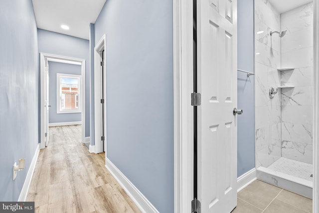 corridor featuring baseboards