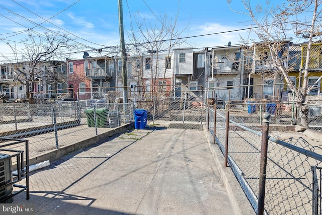 view of home's community with a residential view and fence