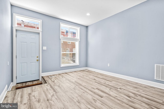 interior space with recessed lighting, visible vents, light wood-style flooring, and baseboards