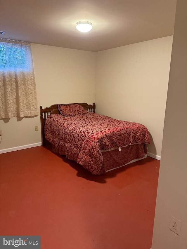 bedroom featuring carpet flooring and baseboards