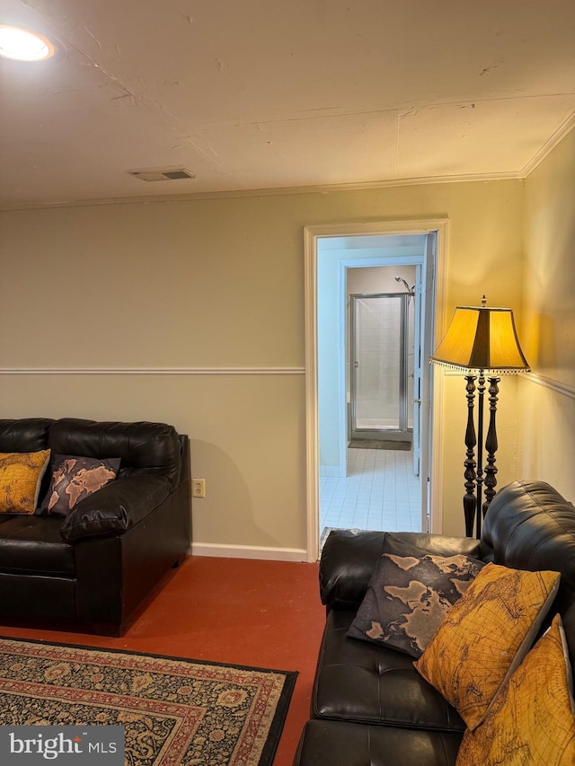 living area featuring visible vents, baseboards, and ornamental molding