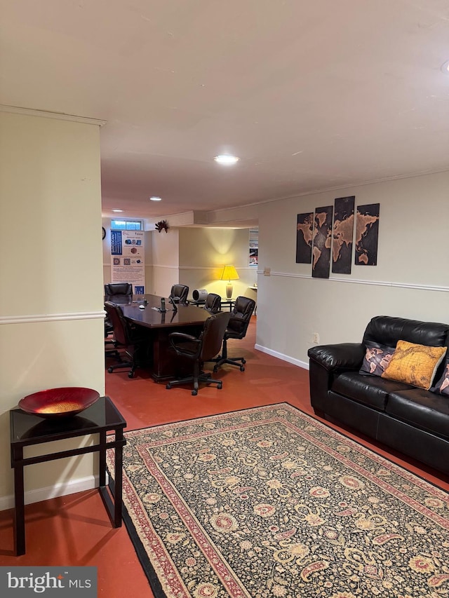 carpeted living area with baseboards