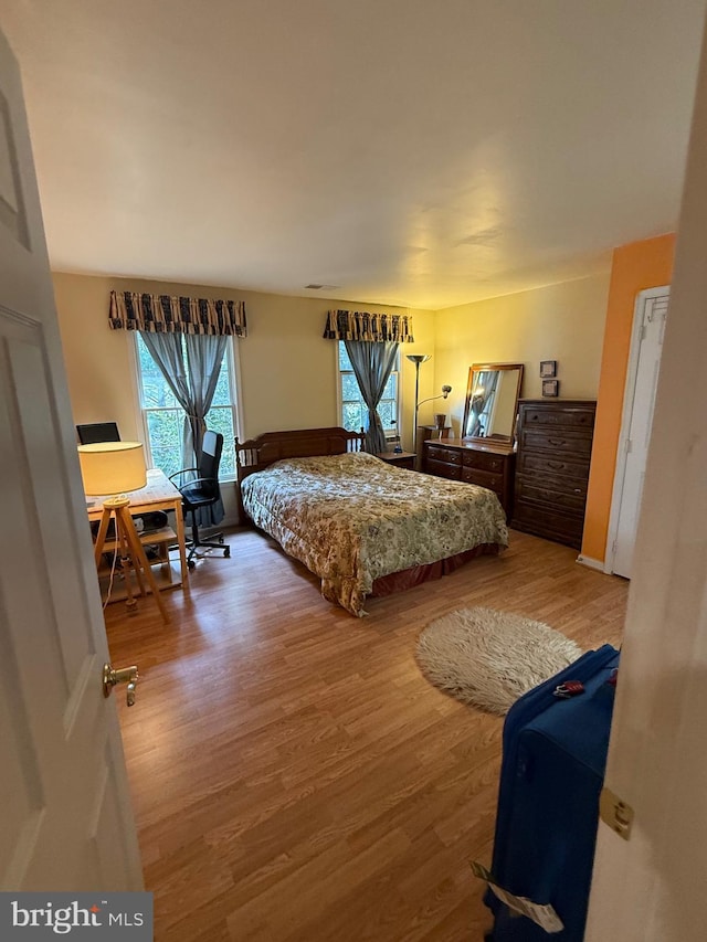 bedroom featuring wood finished floors