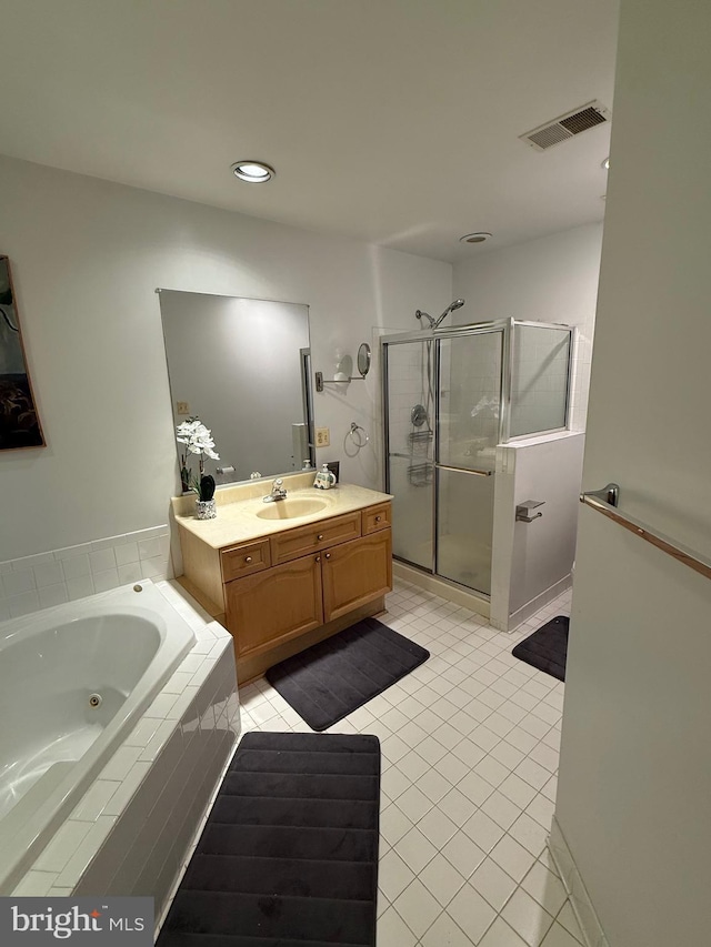 full bath with visible vents, a shower stall, tile patterned floors, a tub with jets, and vanity