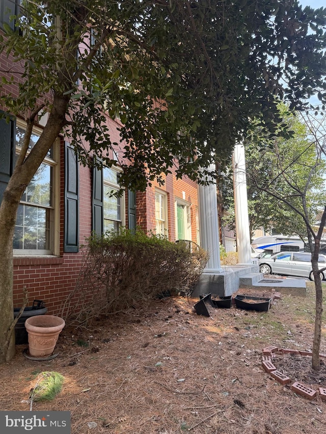 view of home's exterior featuring brick siding