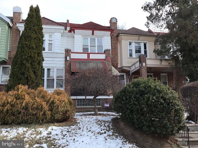 view of front of house with a chimney