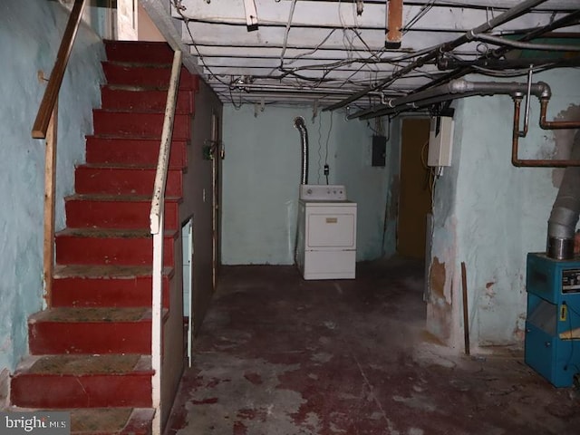 unfinished basement with stairway, electric panel, and washer / clothes dryer