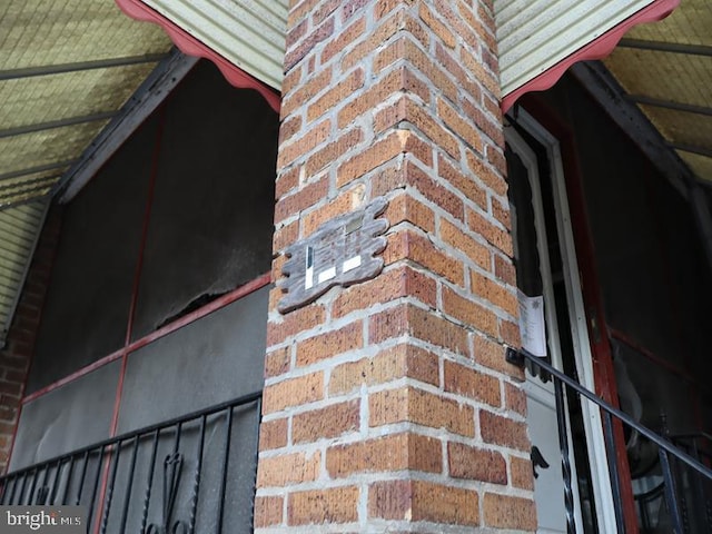 exterior details featuring brick siding