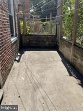 view of patio featuring fence