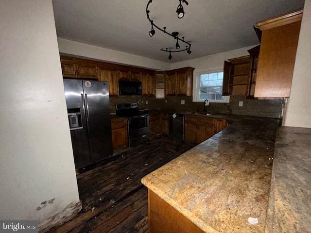 kitchen featuring black appliances and a sink