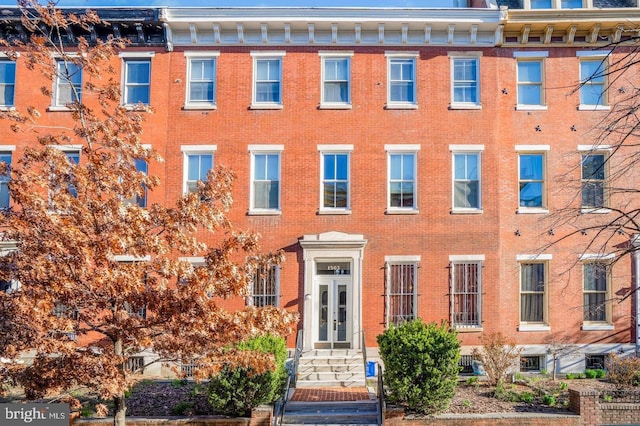 view of front of house featuring brick siding