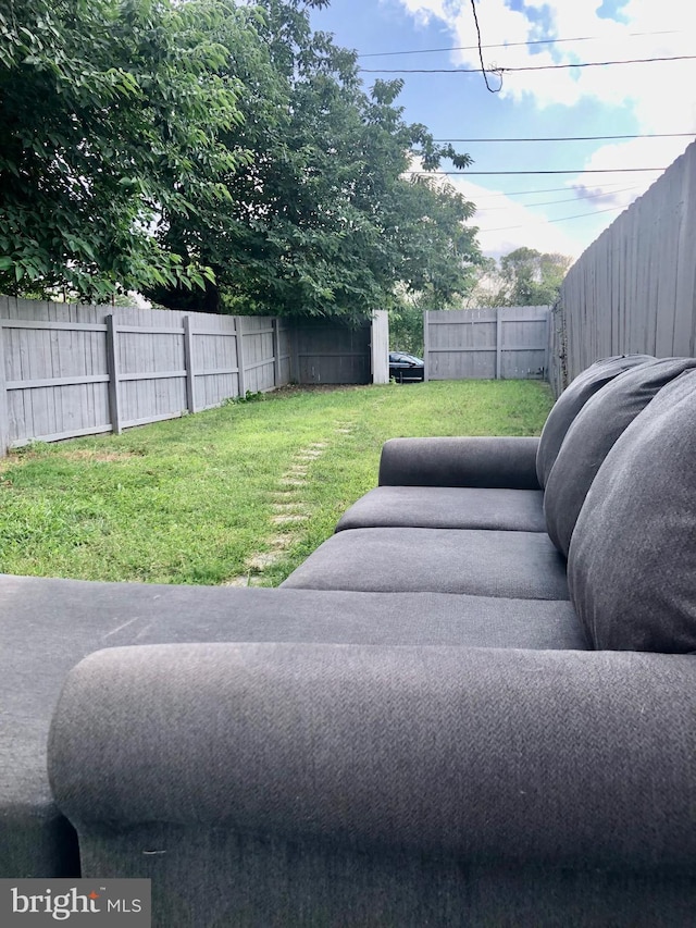 view of yard with a fenced backyard