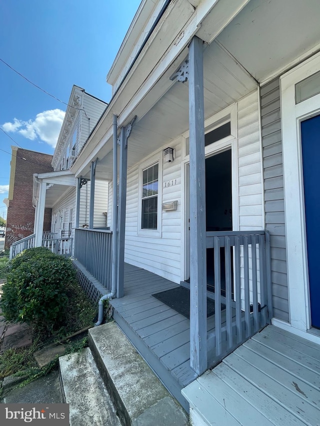 doorway to property featuring a porch