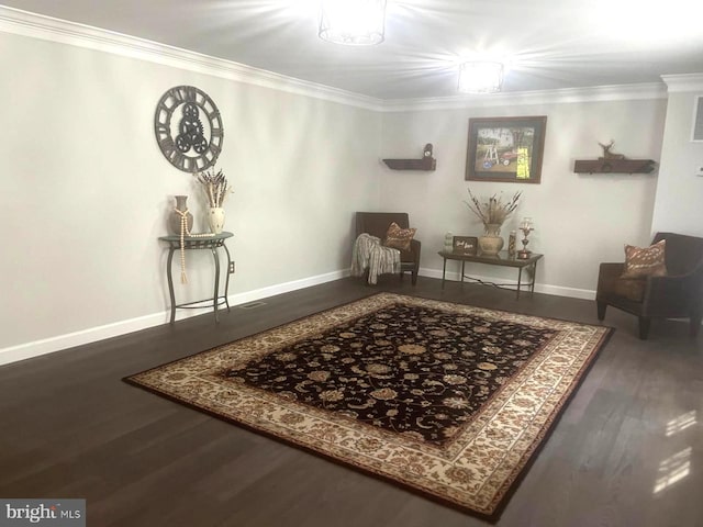 living area featuring baseboards, dark wood finished floors, and crown molding