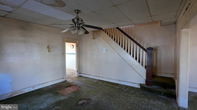 interior space featuring stairway and a drop ceiling