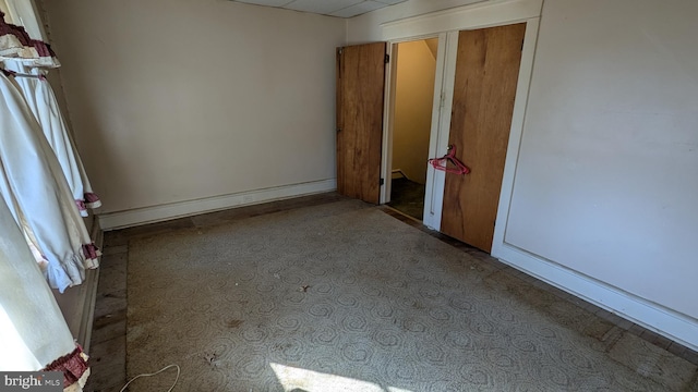 unfurnished bedroom featuring baseboards